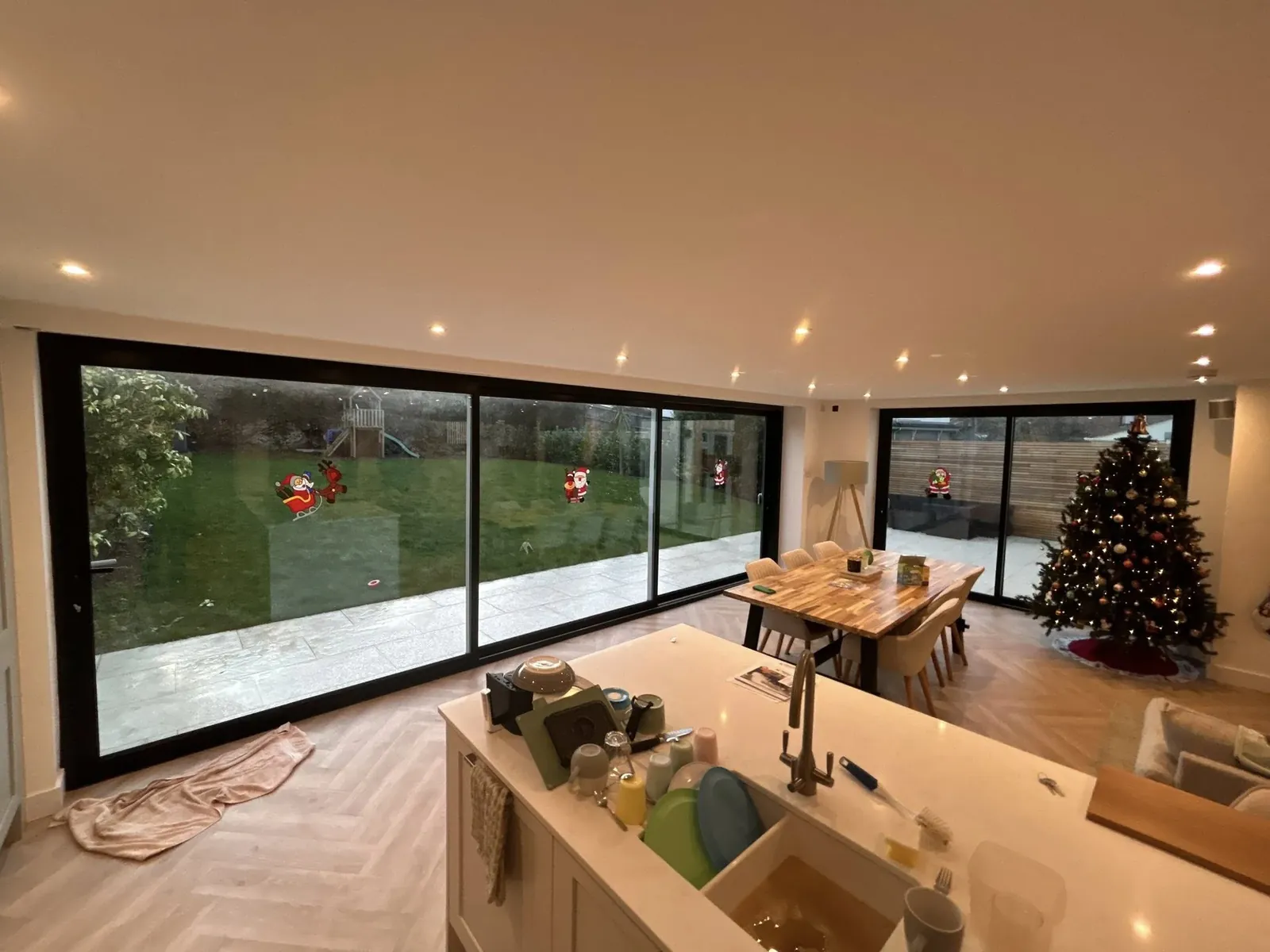 Dark-framed picture window above a kitchen worktop