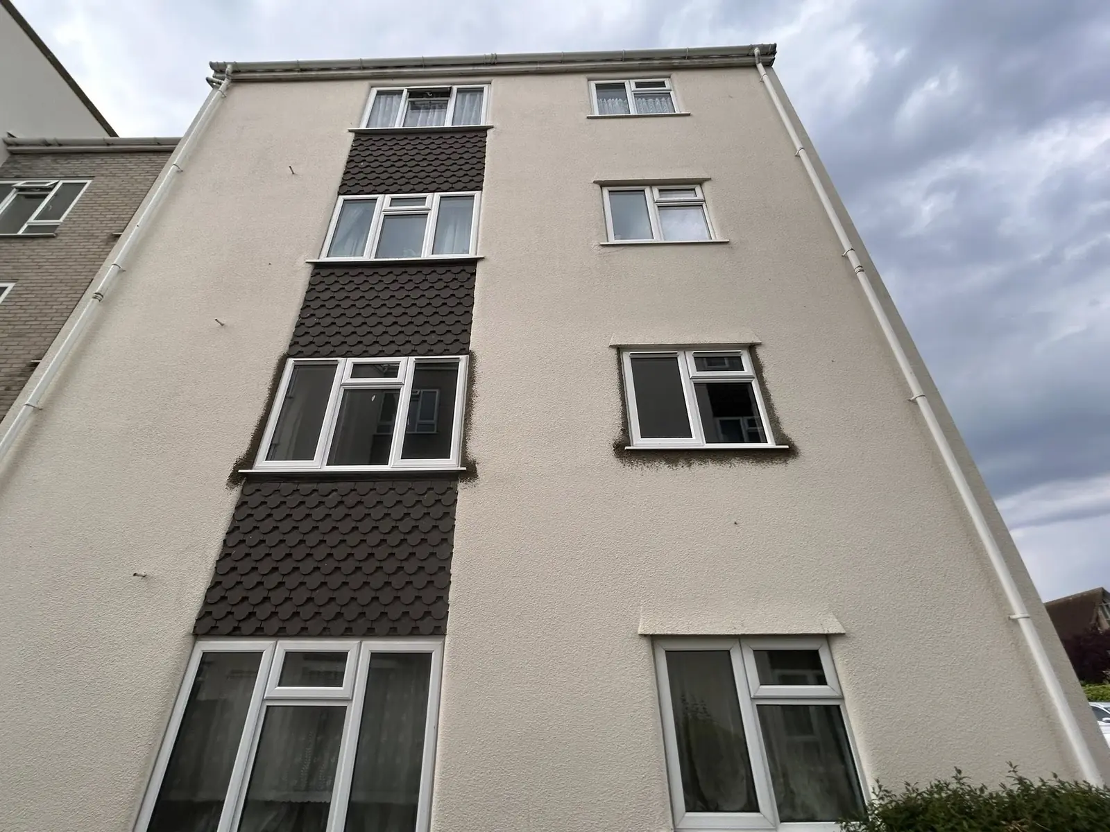 White replacement windows on a multi-storey building