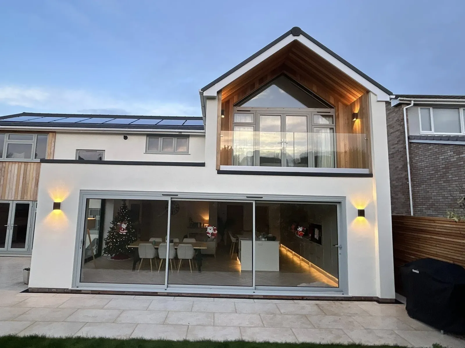 Wide glazed doors across a rear extension