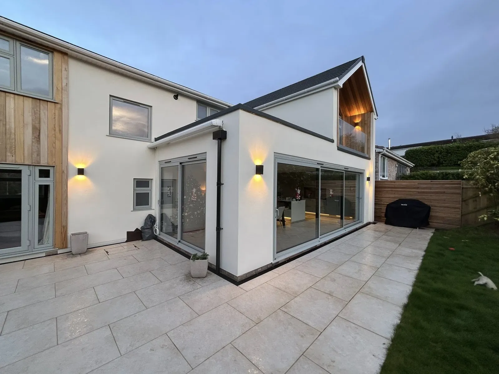 Rear extension with full-width dark-framed glazing