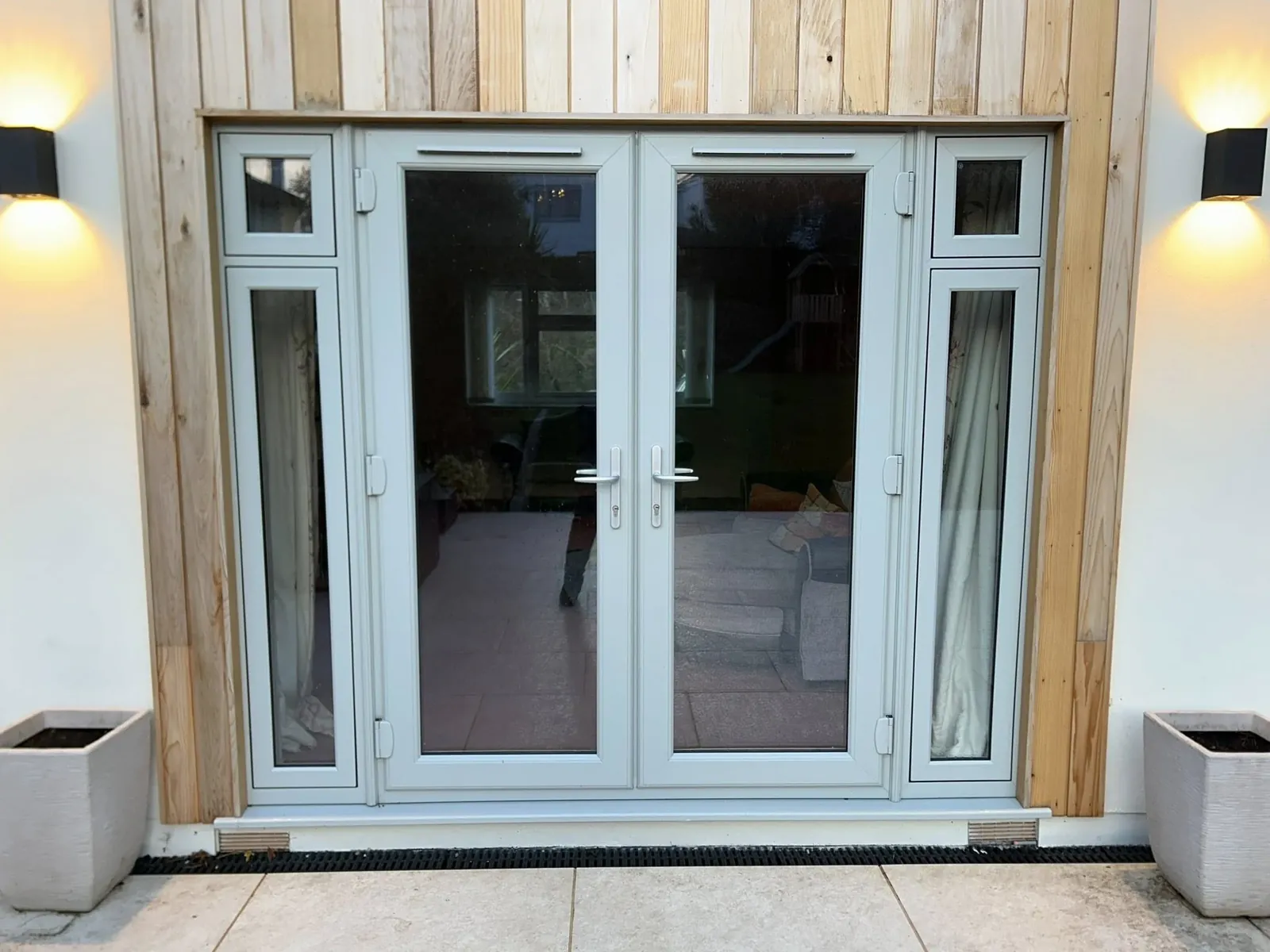 White French doors with glazed side panels